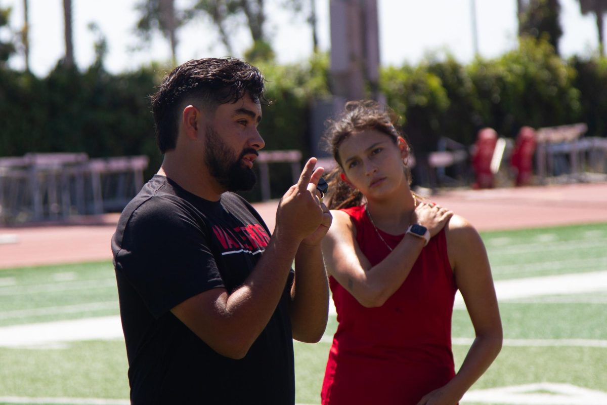 Alex Zermeno offers insight to midfielder Athena Raelynn Bow-Graham during practice on Thursday, Sept. 7, in Santa Barbara, Calif.