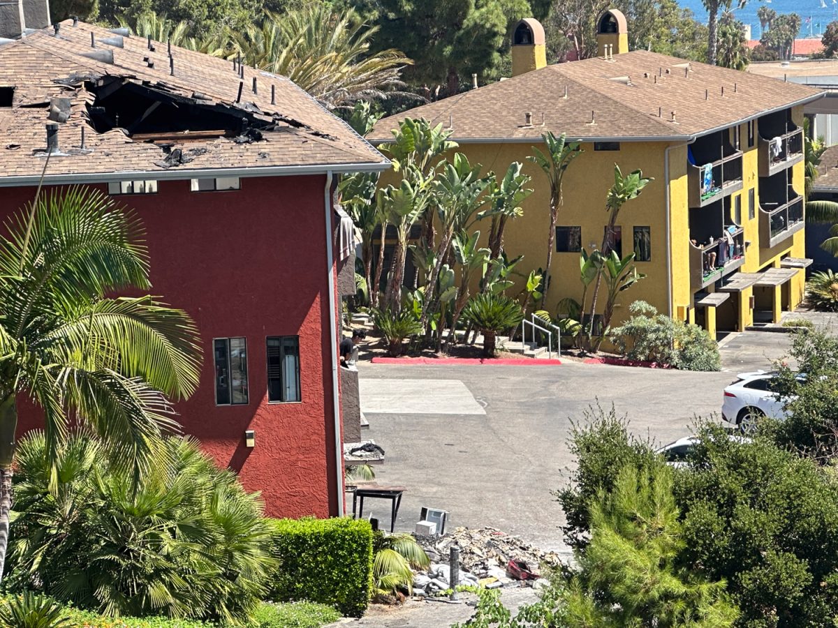 On the morning of Sept. 10, a large hole in the roof exposes the damage done to building 807 by the fire. Debris blocks a portion of the parking lot at Beach City in Santa Barbara, Calif.