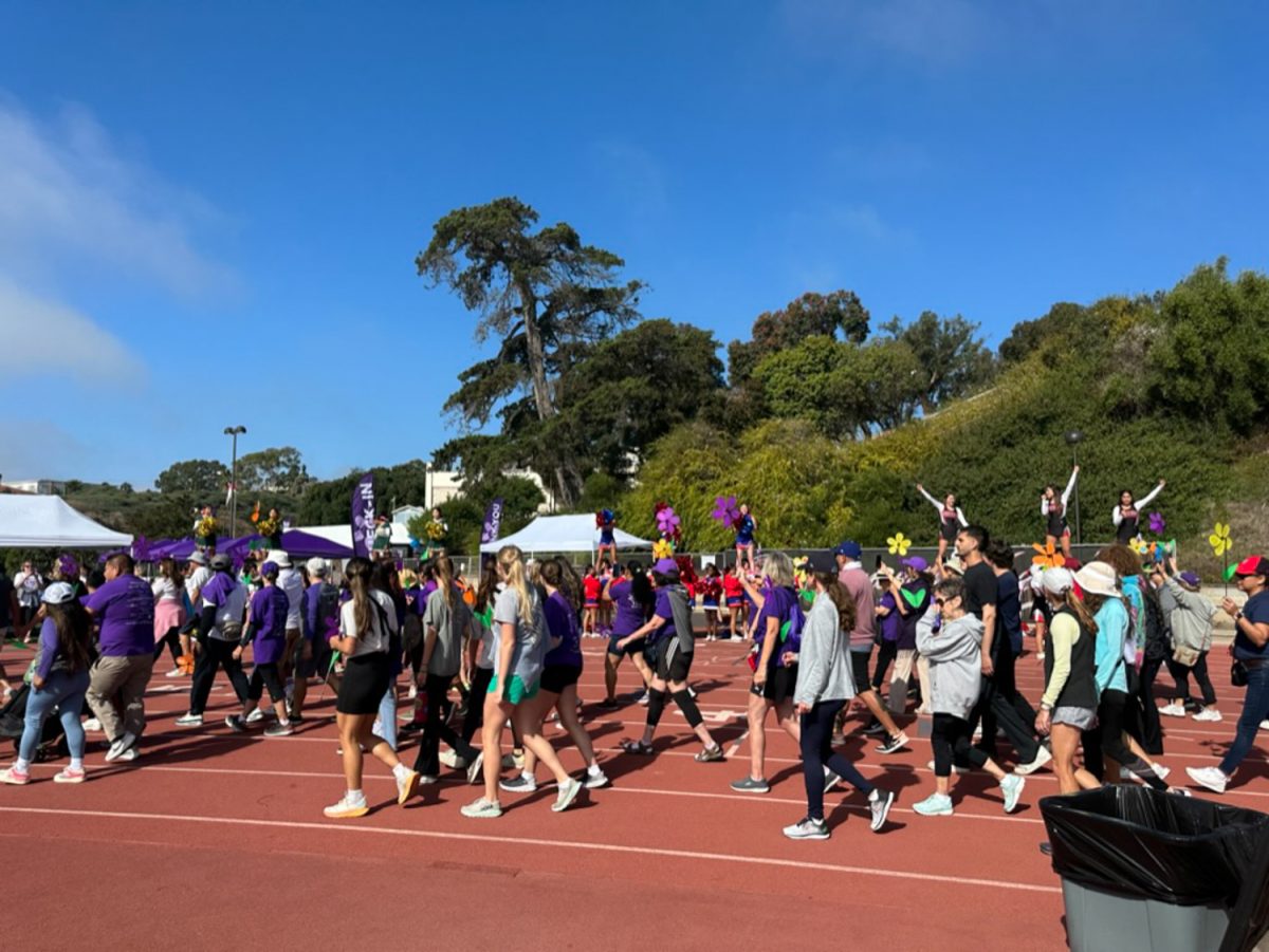 Santa Barbara community members begin the march for the Walk To End Alzheimers on Saturday, Oct. 14 at La Playa Stadium in Santa Barbara, Calif. There were many cheerleaders from local Santa Barbara high schools to cheer on the participants. 