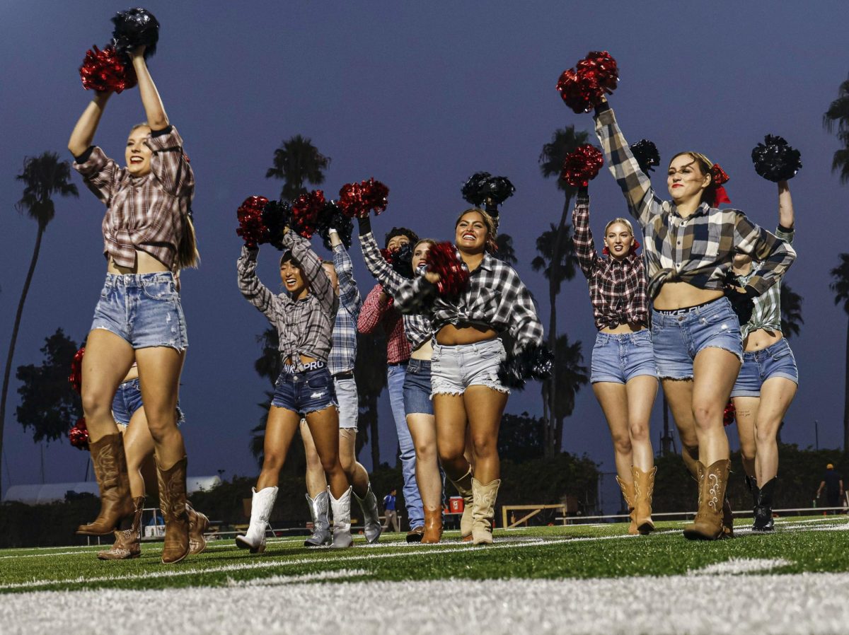 The cheerleading team performs on September 23 at City College's La Playa stadium in Santa Barbara, Calif. The cheer program returned this fall after a three year hiatus.
