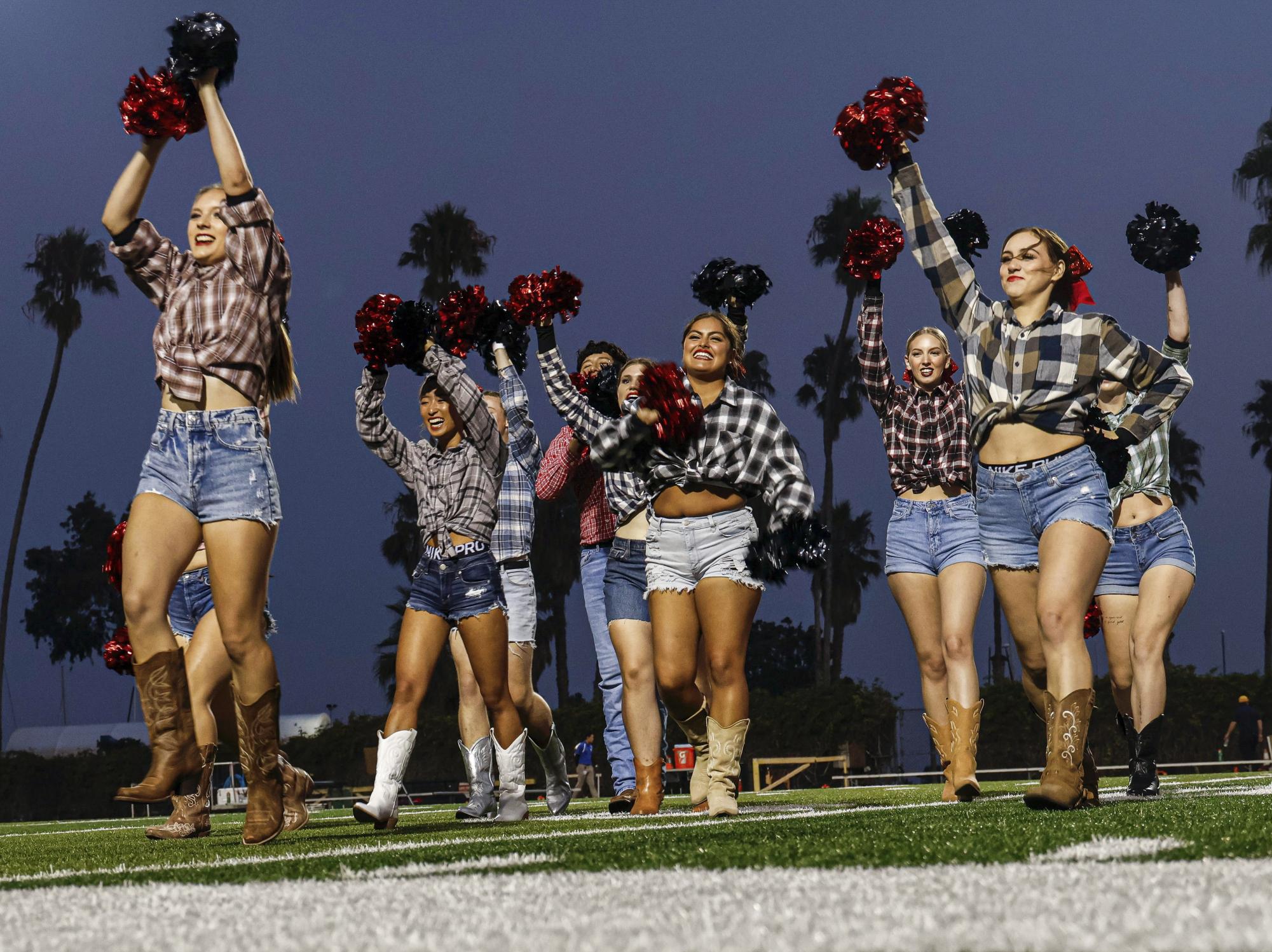 The cheerleading team performs on September 23 at City Colleges La Playa stadium in Santa Barbara, Calif. The cheer program returned this fall after a three year hiatus.