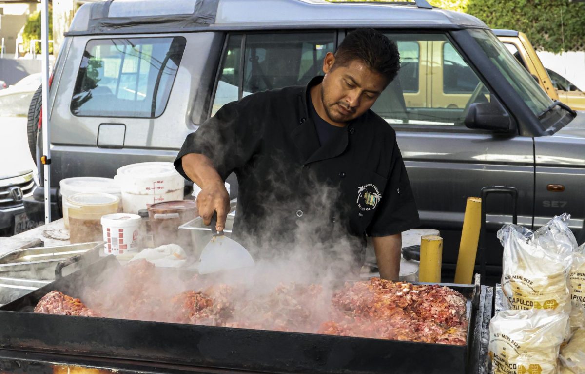 Roger Jimenez prepares carne asada an hour before the Roger's Taco stand opens for business on Saturday, Sept. 30th in Isla Vista, Calif. Jimenez commutes from Los Angeles a couple time each week to set up his stand for Isla Vista residents.
