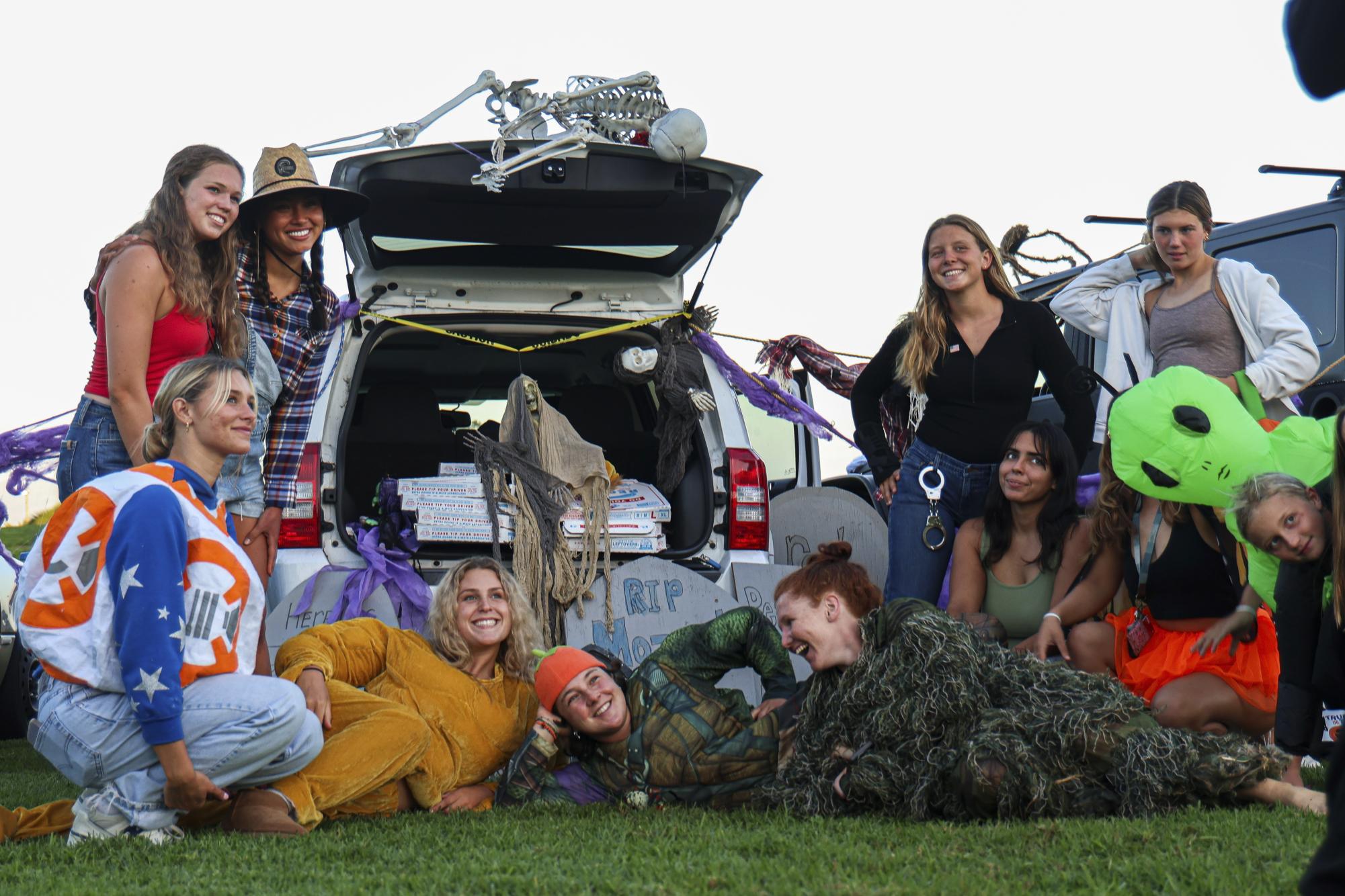 City College students surround their trunk decorations during Trunk-or-Treat on on Oct. 6 at City Colleges West Campus in Santa Barbara, Calif. All participants were judged on their set-ups, and an award was given out for the best decorations.