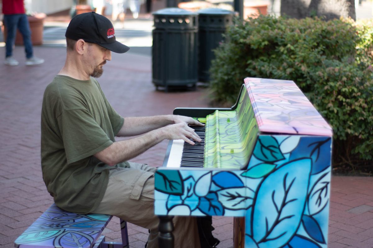 David Paul Jack plays a dramatic song on a piano painted by Elzy Sherlock on Oct. 12 on the corner of Carrillo and State streets in Santa Barbara, Calif. "Since I moved here when I was eight, so most of my life," Jack says, explaining how long he has been playing piano for.