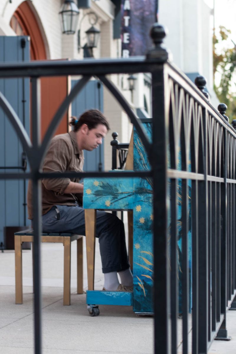 Sam Bufe plays a melody on the piano on Victoria Street on Oct. 10. in Santa Barbara, Calif. "I have an electric piano at home, but sometimes it's nice to really feel it," Bufe says as he explains why he enjoys playing the pianos on State Street.