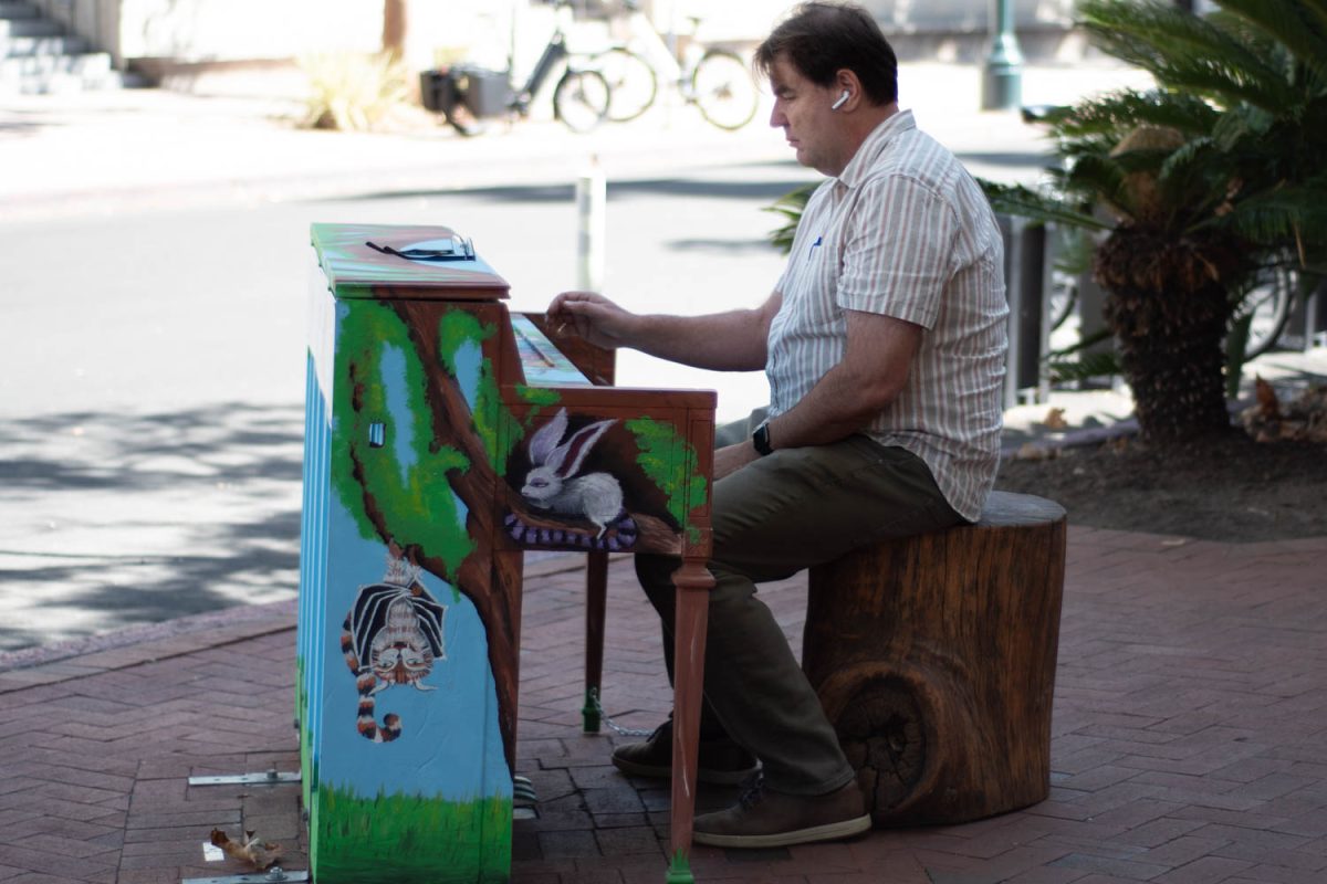 Steve Welton enjoys playing a monster-painted piano on Oct. 12 the corner of Anapamu and State streets in Santa Barbara, Calif. "It's great, they are a little out of tune but what are you going to do," Welton said while talking about how he enjoys playing the Pianos on State Street.