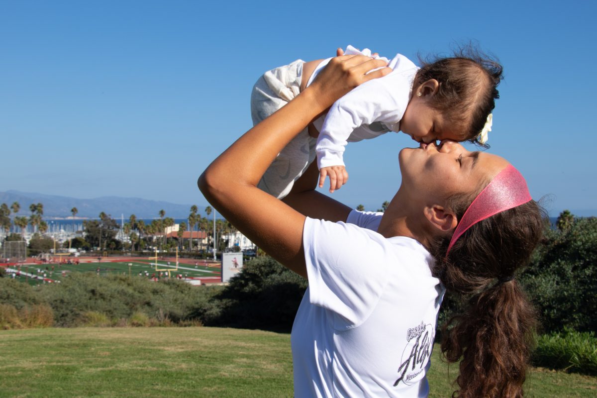 Gizela Zermeno holds up her four-month-old daughter Amariz Zermeno and kisses her nose on Oct. 26 in Santa Barbara, Calif. Zermeno played for City Colleges soccer team throughout her pregnancy, and her daughter has become a celebrity among the team.