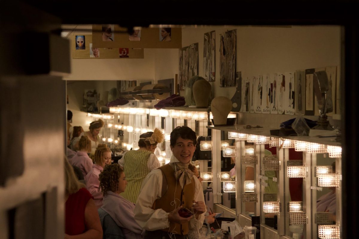 Luke Hamilton tap dances around the dressing room in full costume as his fellow actors prepare for another night on the stage on Oct. 19. Hamilton has taken on the lead role in Emma at SBCCs Garvin Theatre in Santa Barbara, Calif.