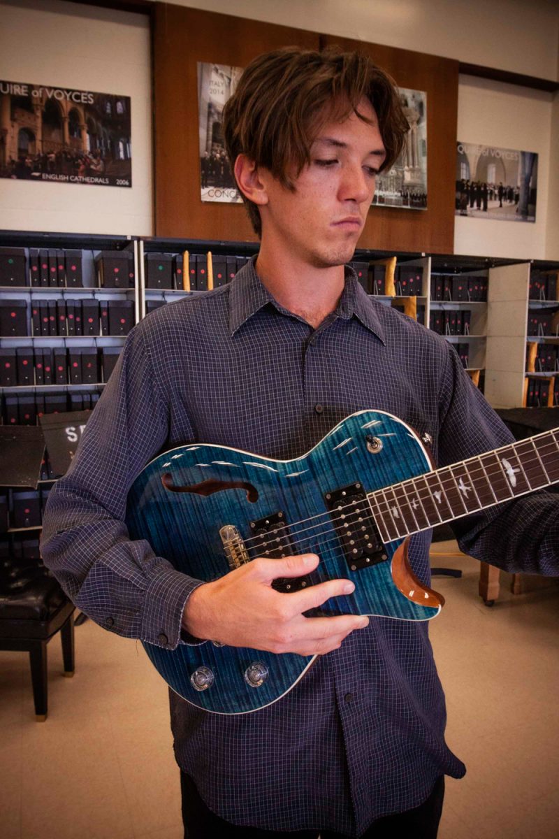 Music major Kayne Hunter, 20, strums his electric guitar in the music department on West Campus on Sept. 29. Kayne played the jazz standard Night and Day by Cole Porter.
