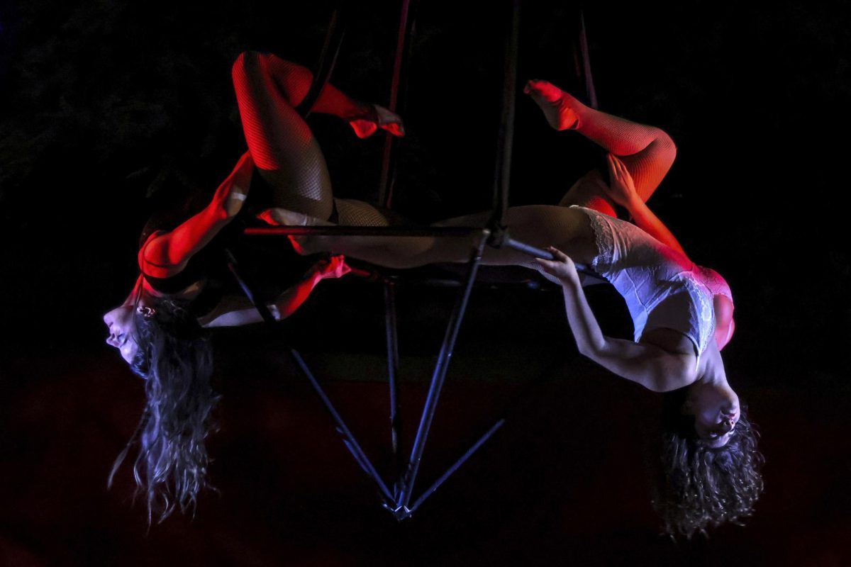 Alison and Ellie Naftaly hang upside down during the Seance performance and Victorian Masquerade presented by Music of Ghost on Nov. 4, 2023 at the SBCAST creative space in Santa Barbara, Calif. Music of Ghost produces otherworldly jams and aerial performances.