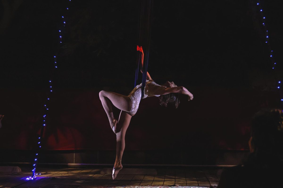 Cindy Walker Macy hangs in mid air during the Seance performance and Victorian Masquerade presented by Music of Ghost on Nov. 4 at the SBCAST creative space in Santa Barbara, Calif. The event offered aerial performances, DJs Dienasty and SkyPounce on the dance floor, and food and drink.