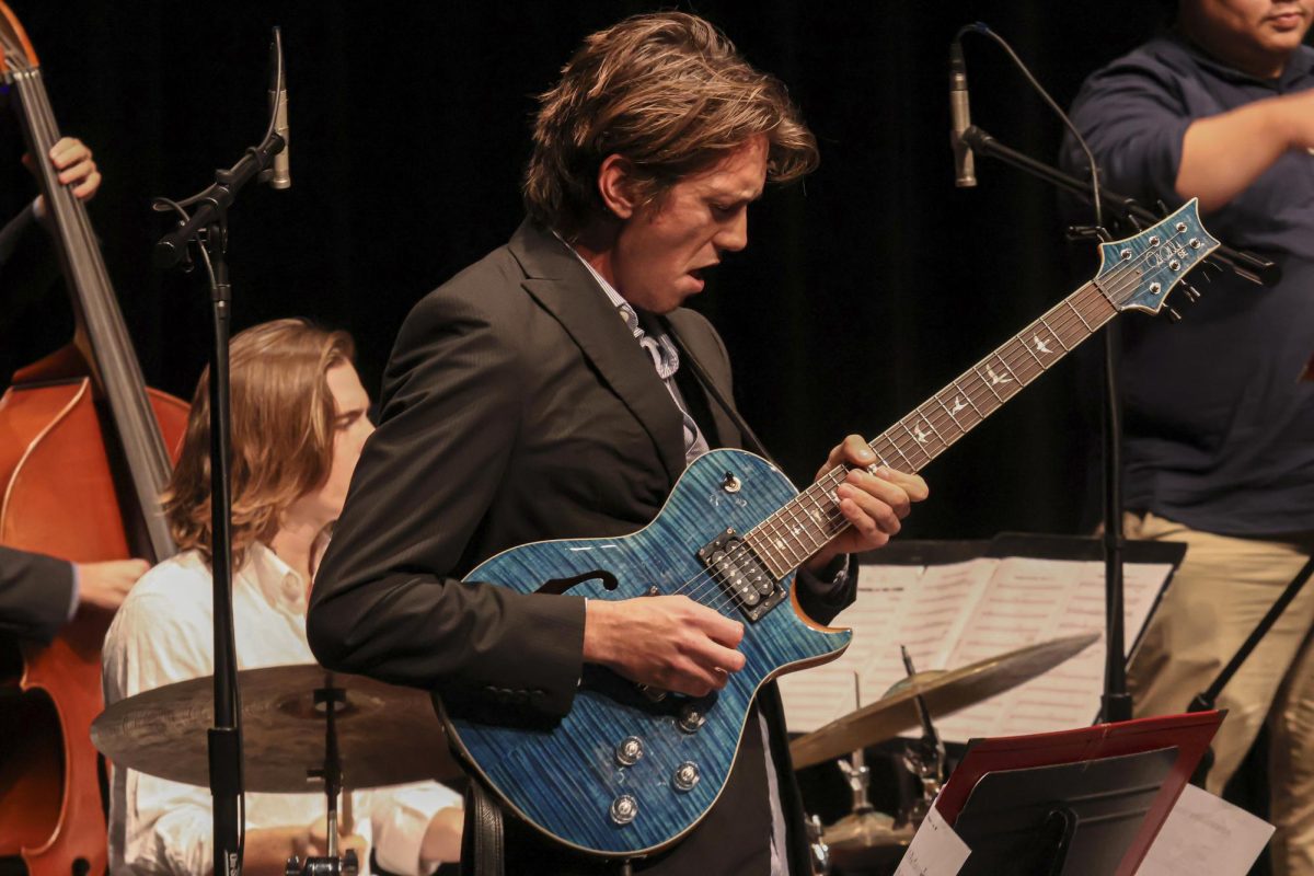 Kayne Hunter strums his guitar strings during the Lunch Break band performance at City Colleges Jazz Ensemble Concert on Nov. 20 at the Garvin Theatre in Santa Barbara Calif. The Lunch Break band, directed by Andrew Martinez, has been selected as a finalist for the Monterey Next Gen Jazz Festival for the past three years.