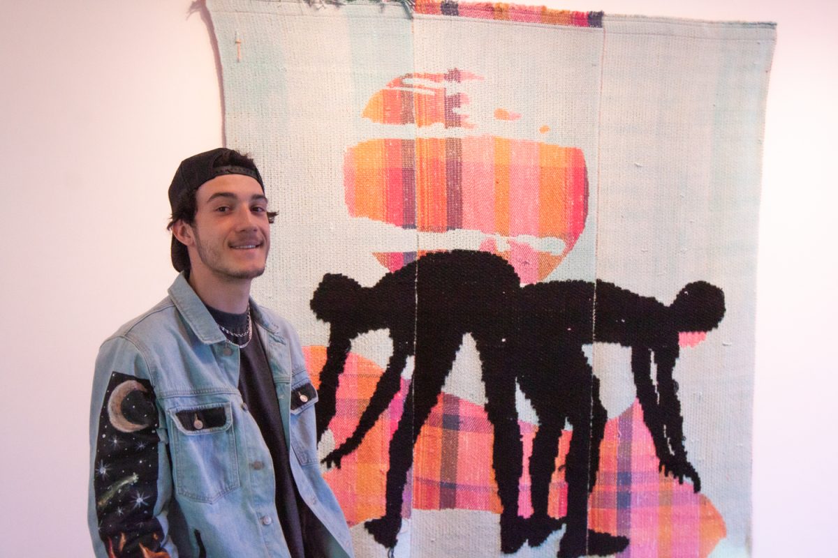 Freddy Janka, 41, Santa Barbara resident, observes an outdoor installation at the Atkinson Gallery on Nov.1, 2023. Janka was attending the"New Landscapes Part I" exhibit opening at the gallery patio.