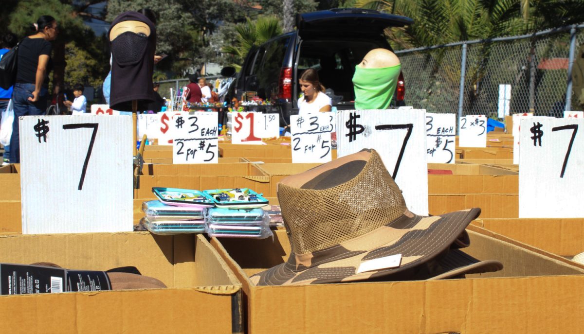 Hats, tops, pants, and more being sold in boxes at the flea market at the Santa Barbara High School on Saturday, Oct. 28 in Santa Barbara, Calif. Customers can pay as little as one dollar for clothing items.