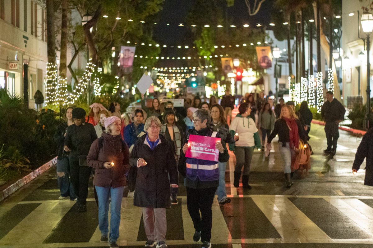 Community members in Santa Barbara march down State St. advocating for womens rights on Jan. 20 in Santa Barbara, Calif. Participants brought both homemade signs and posters from Planned Parenthood reading Abortion is Health Care and a womans place is in the resistance.  