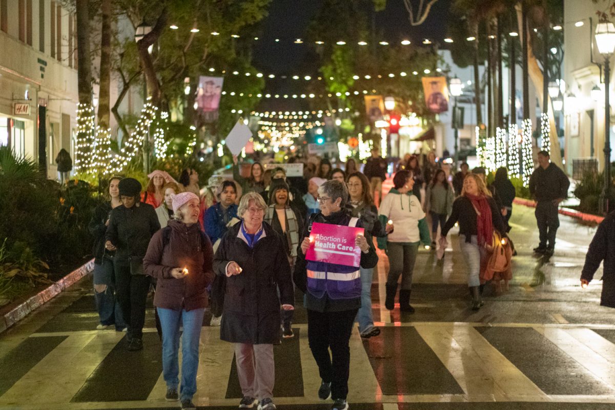 Community+members+in+Santa+Barbara+march+down+State+St.+advocating+for+womens+rights+on+Jan.+20+in+Santa+Barbara%2C+Calif.+Participants+brought+both+homemade+signs+and+posters+from+Planned+Parenthood+reading+Abortion+is+Health+Care+and+a+womans+place+is+in+the+resistance.++