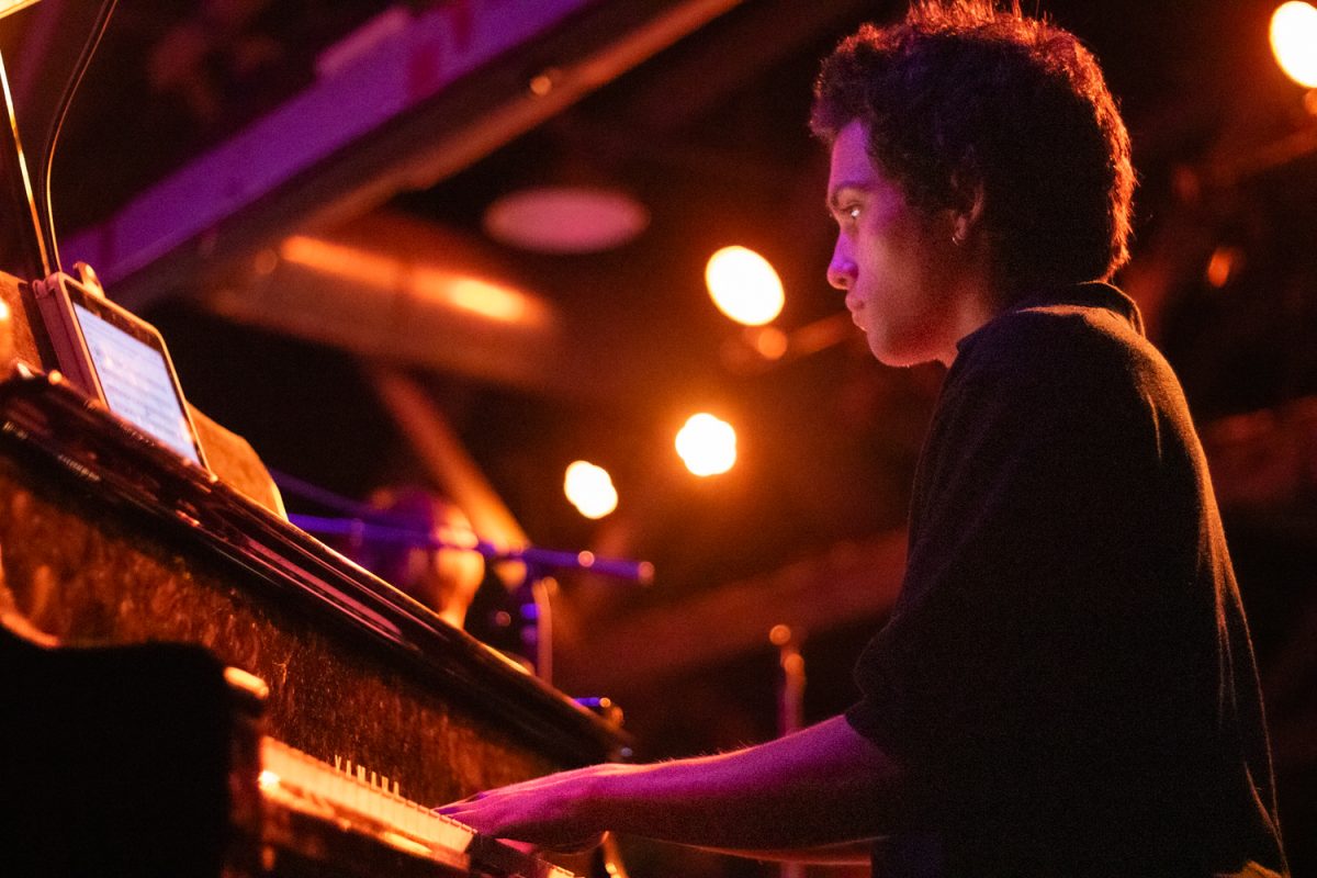 Cainan Birch radiates during his piano solo during his SOhO performance on Feb. 12 in Santa Barbara, Calif. Birch played piano for the three big bands that preformed that night, receiving a thunderous applause after his solos.