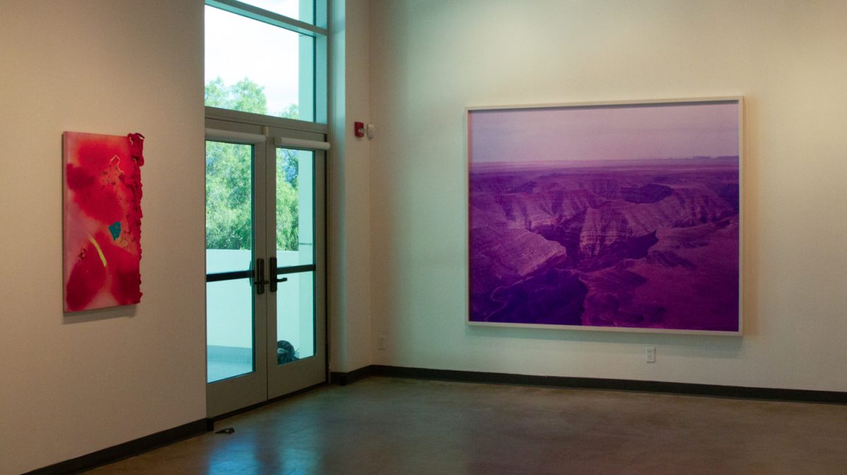 From left, "Dr1p" by Gabriela Ruiz and "Muley Point 11, Bears Ears National Monument, Utah" by David Benjamin Sherry stand side by side at the Atkinson Gallery, displaying the many different artistic mediums that are showcased on Feb. 8 in Santa Barbara, Calif. Ruiz's used a melody from spray paint to mirrors to insulation foam to create a three-dimensional piece, while Sherry chose a chromogenic print, creating a violet tint.