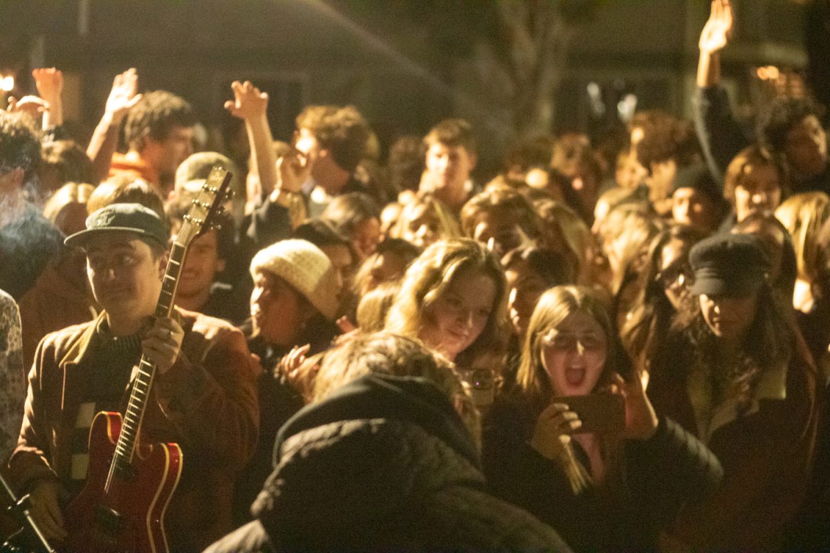 A crowd filters in and out of a house party to crowd surf, dance with friends, and tune into local music on Feb. 9 in Isla Vista, Calif. Beginning on Feb. 10, house party capacity is capped at 250 people, along with new party regulations enforced by Isla Vista Foot Patrol, with potential for these late-night gigs to be shut down if any new rules are violated.