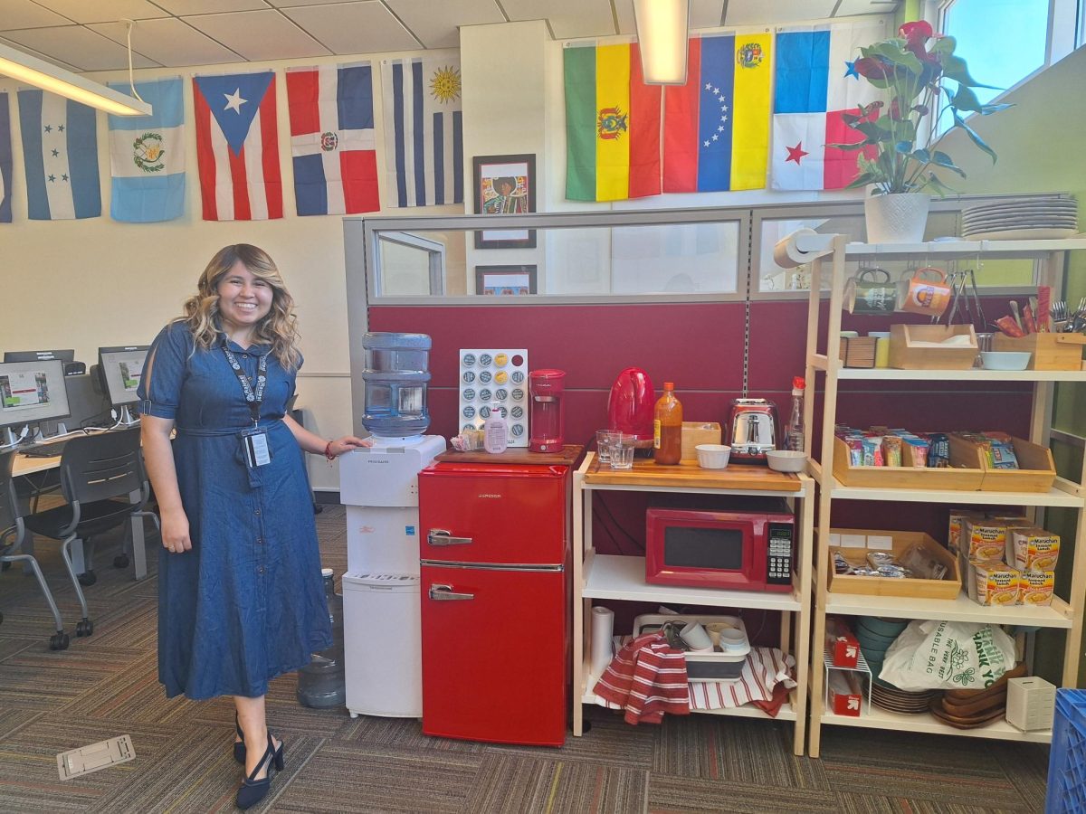 Nathalie Quintero beams next to the snack cart in the Raíces in the West Campus Center on March 15 at City College in Santa Barbara, Calif. Quintero is the newest addition to the “Raíces: First Year and Beyond” family, working as a program advisor.