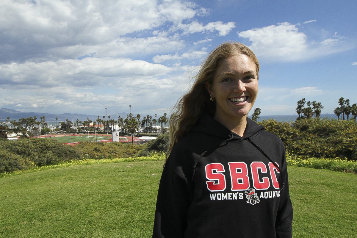 President of Triathlon club Ava Smith smiles into the camera on March 18, at The Great Meadow on SBCC’s east campus. “I hope to educate more people about my club,” Smith explained.