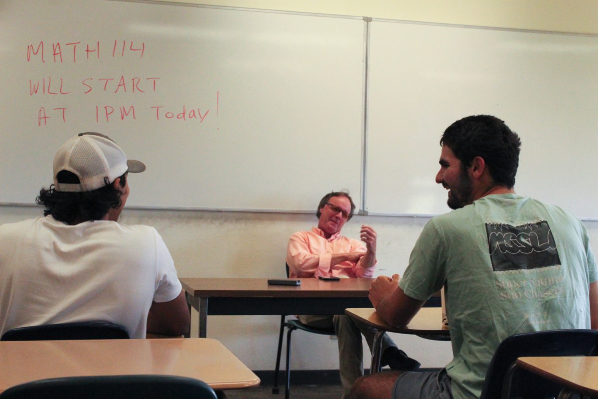 From left, Vice President Rehan Ameen, Club Advisor Steven Clark, and Club President Francis Jacobs discuss plans for the Global Perspectives Forum Club at the final meeting of the year, on May 8 at City College in Santa Barbara Calif. 