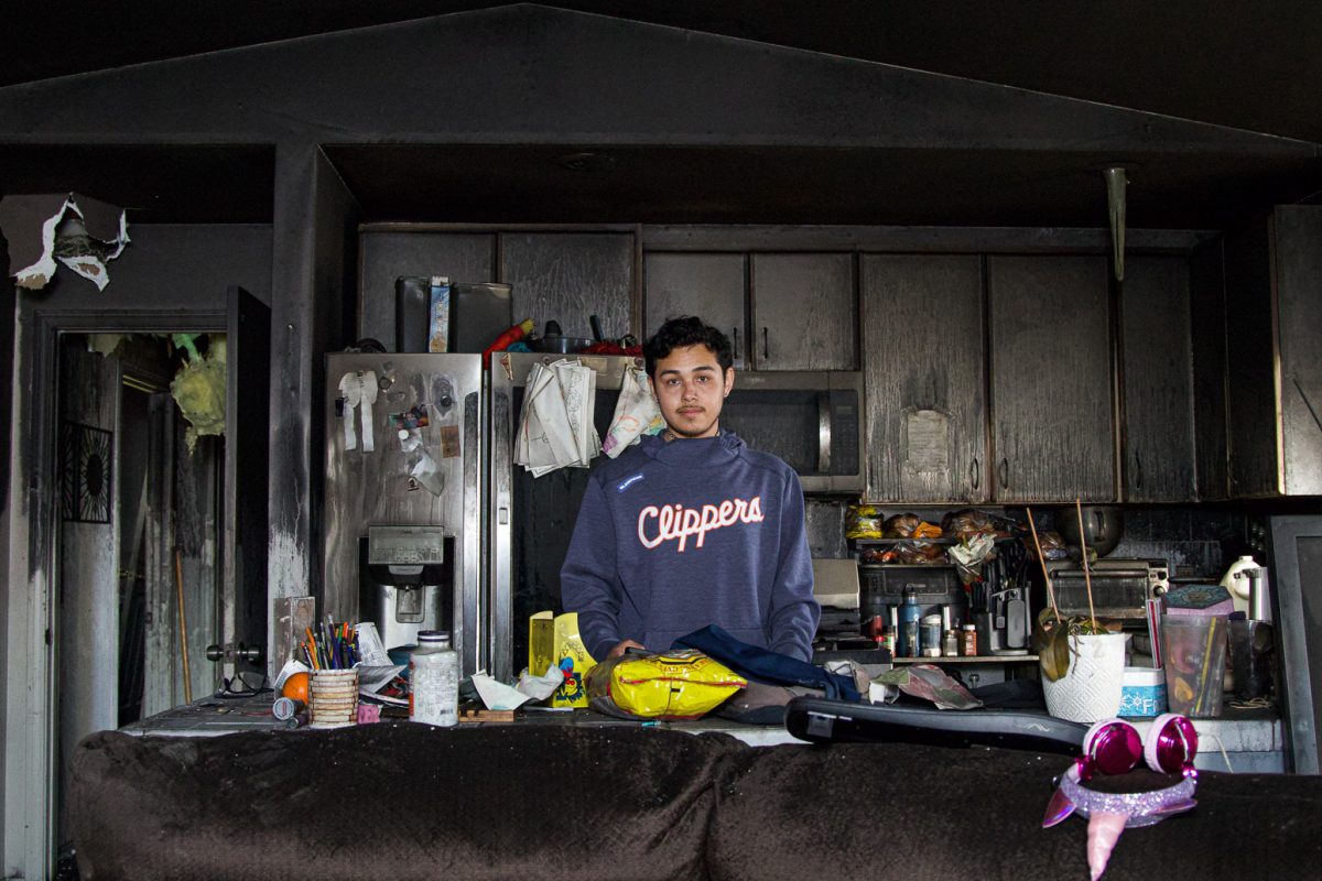 Anthony Zell stands in solitary in the kitchen of his childhood home on Feb. 16 in Santa Barbara, Calif. While no individuals were harmed, Zell's father and two dogs were helped down from the second story balcony.