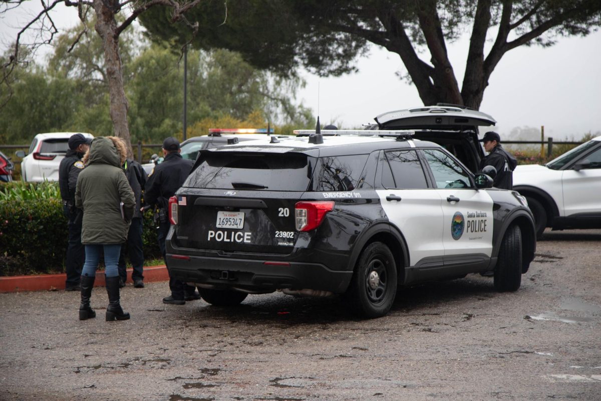 Police cars fill parking lot 1A at 3:08 p.m. on Feb. 12 in Santa Barbara, Calif. The parking lot opened 4:33 p.m.