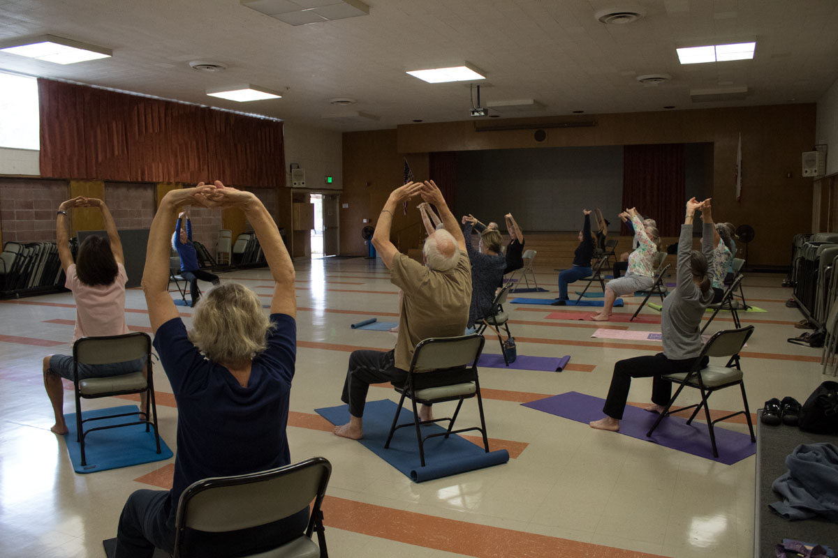 File photo: All ages and stages yoga class working on arm flexibility by copying teacher Fredda Spirka Tuesday, Sept. 12, 2017 in Wake Campus Room 33 in Santa Barbara, Calif. Spirka’s class is every Tuesday from 9:30 to 10:30 a.m.