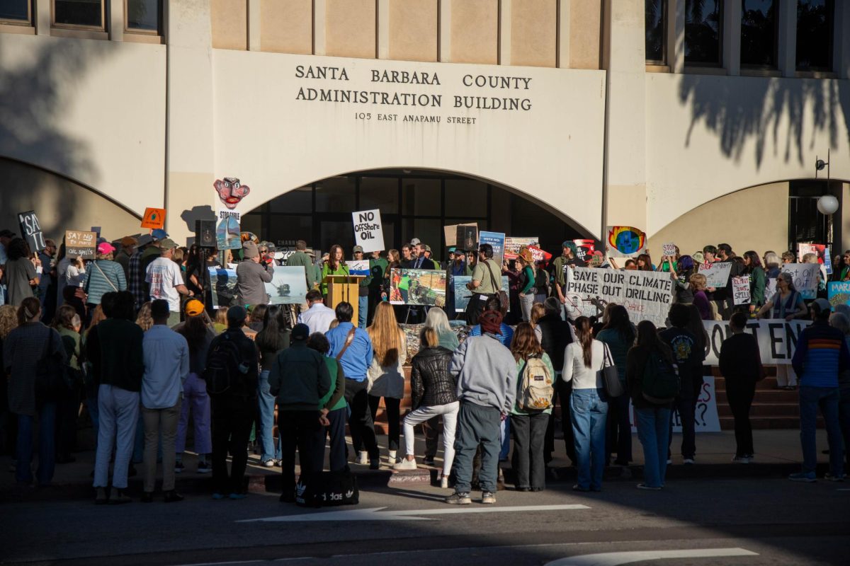 Protesters gather outside of the Santa Barbara County Administration Building  on Feb. 25 in Santa Barbara, Calif. Students and community members rallied against the permit transfer to Sable at the Santa Barbara County Board of Supervisors meeting.