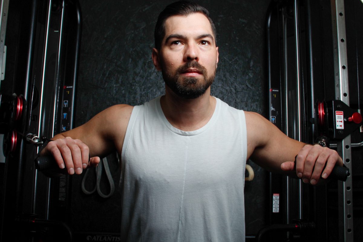 Ken Watts uses the cable chest press machine on April 9 in Santa Barbara, Calif. "[What] people value the most in personal training is accountability," Watts said.