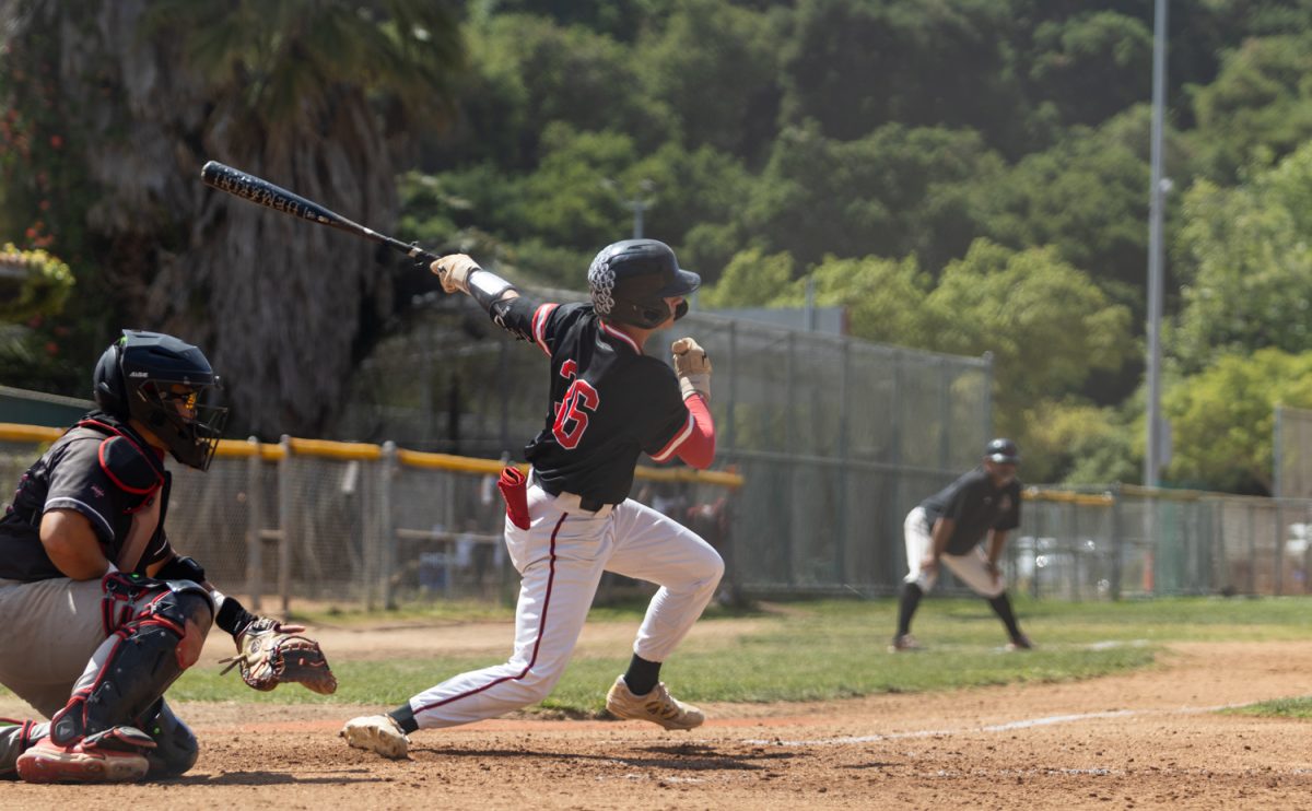 Benjamin Strutt (No. 36) connects with a solid swing April 12 at City College's Pershing Park in Santa Barbara, Calif. Strutt would later come close to taking third base.