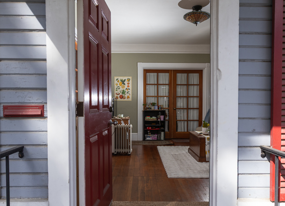 The crimson front door of the home shared by The Channels Editor-in-Chief Sylvia Stewart and her roommates swings open April 25 in Santa Barbara, Calif. Built in 1928, the house still contains an old fashioned mail slot. 
