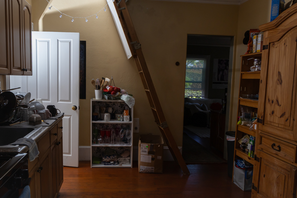 A steep ladder connects the kitchen to the attic bedroom on April 25 in Santa Barbara, Calif. According to residents, someone has fallen from it before, highlighting the potential dangers of makeshift student housing setups. 

