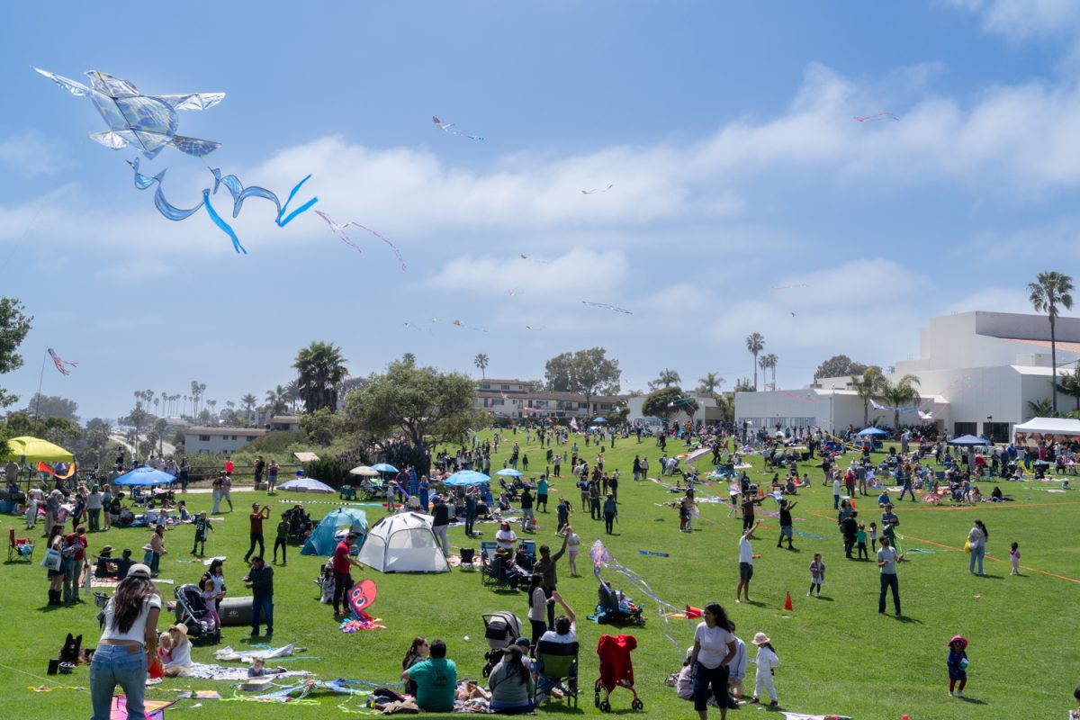 People fill the West Campus Great Meadow at City College as colorful kites fill the sky during the 39th annual Kite Festival on April 13 in Santa Barbara, Calif.