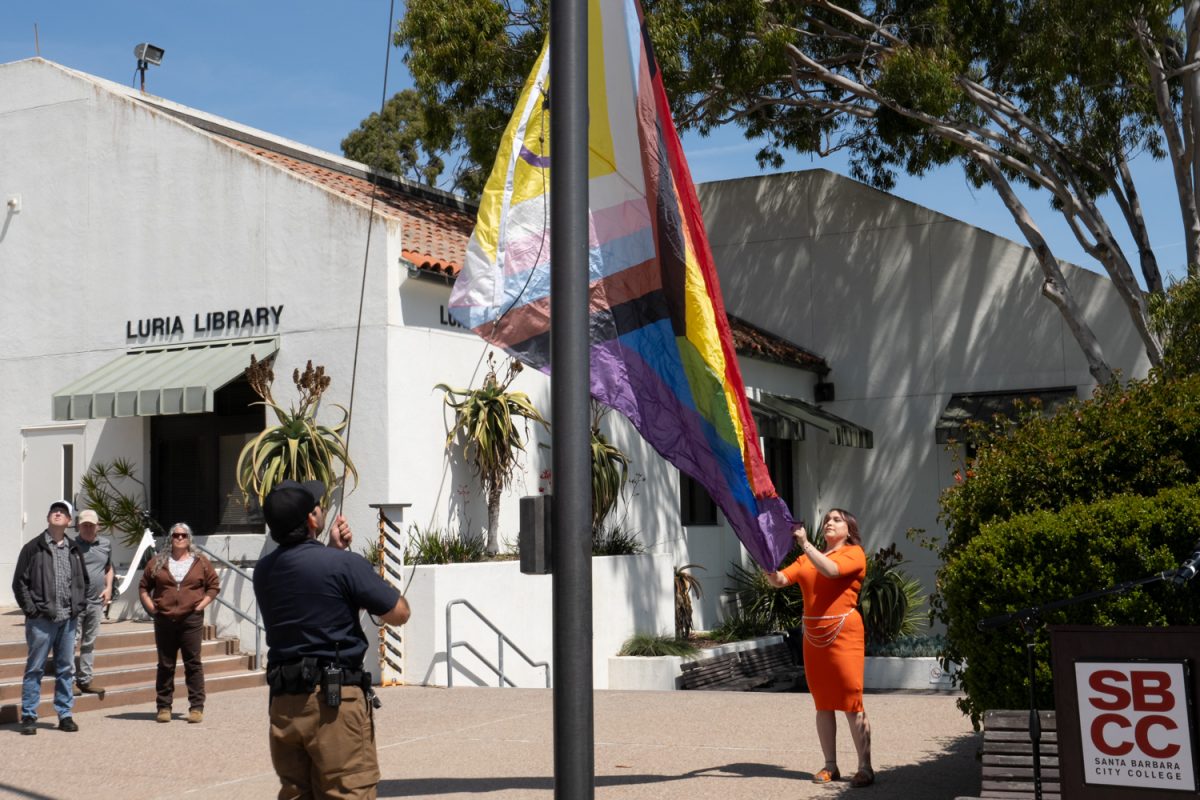 People attend the Pride flag raising ceremony, April 7 at the Luria Library Patio at Santa Barbara City College in Santa Barbara, Calif.
