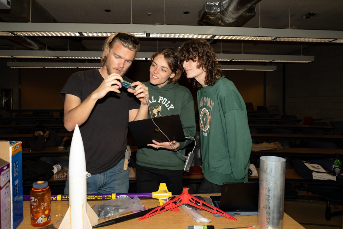 On April 4 at the Physical Science Building Room 130 at City College in Santa Barbara, Calif., members of the Aerospace and Rocket Club worked on avionics for the rocket. From left to right: Logan Hillyer, Kaustubh Pawar, and Jade Porter of the avionics team. 