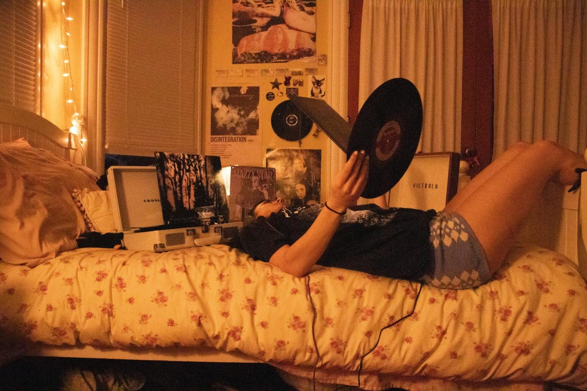 Sylvia Stewart plays "Still" and "So Tonight I Might See" on her record players on May 15 in Santa Barbara, Calif. Stewart has two record players for double the Mazzy.