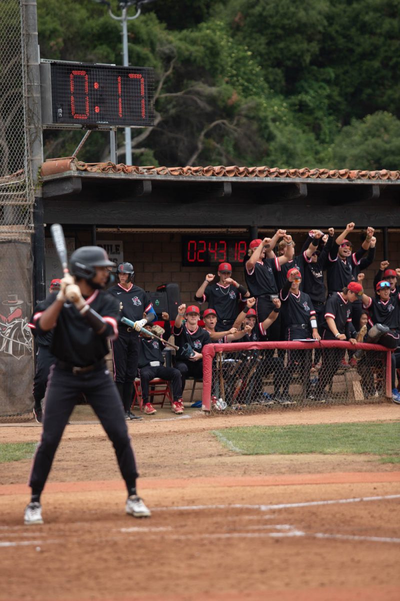 SBCC baseball team cheers on Michael Firestone on May 2 at Pershing Park in Santa Barbara, Calif. The team was down 1-0, and was cheering everyone on to boost team morale.
