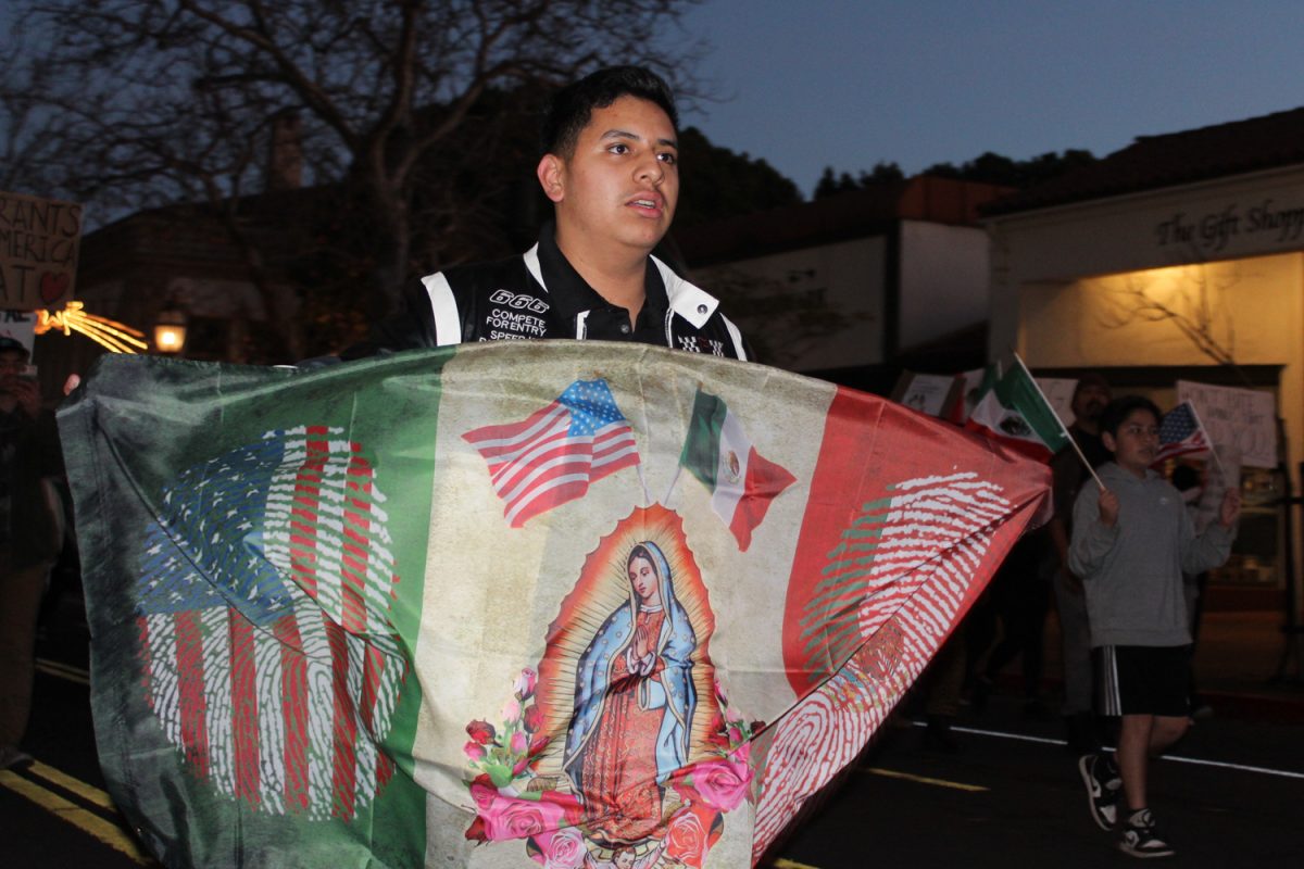 Milton Alejandro Lopez Plascencia holds a flag showcasing the United States and Mexico on Feb. 7 in Santa Barbara, Calif. “It’s heartbreaking to see what is happening all across the country,” Lopez Plascencia said. “I [want] my voice to be heard by the community.”